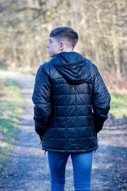 istock Teenage boy outside on a bright Spring day 1132818451