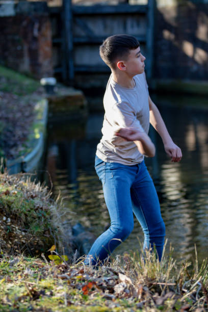 istock Teenage boy outside on a bright Spring day 1132820063