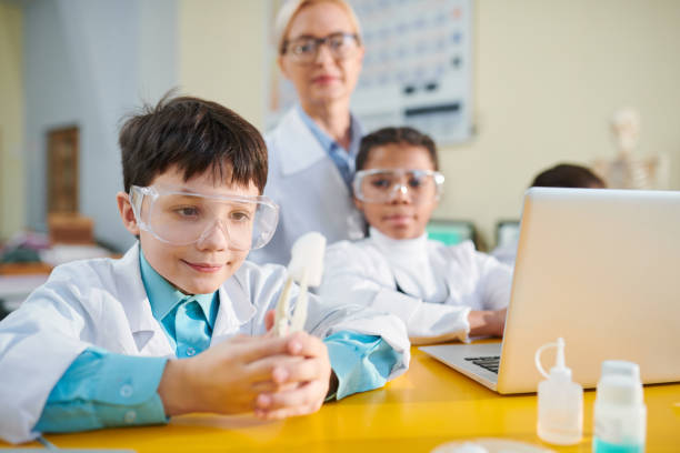 istock Boy at chemistry lesson 1132821160