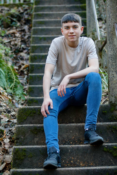 istock Teenage boy outside on a bright Spring day 1132822377