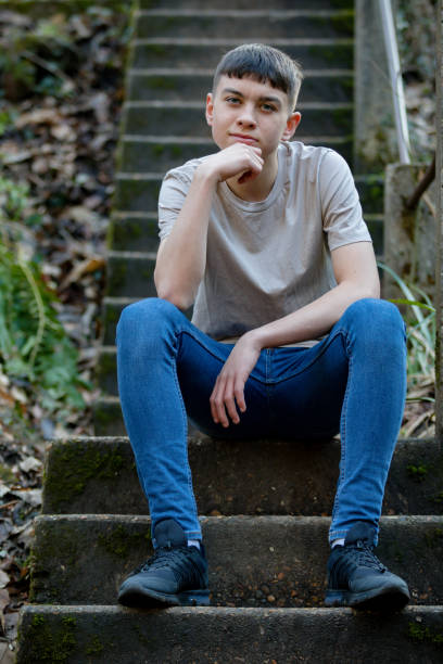 istock Teenage boy outside on a bright Spring day 1132823171