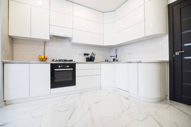 white clean transparent new kitchen with lighting in the house