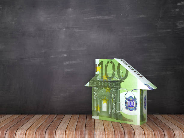 istock Euro Bill Puzzle House on Wood Floor - Chalkboard Background - 3D Rendering 1132825821