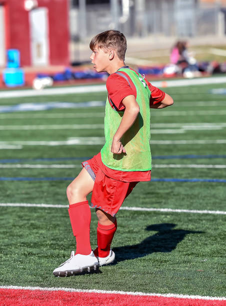 istock High School boy athlete making amazing plays during a soccer game 1132826359