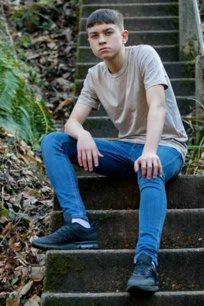 istock Teenage boy outside on a bright Spring day 1132827487