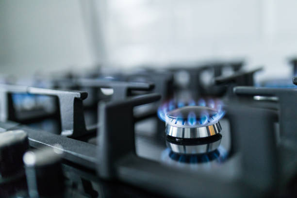 istock Cooktop with burning gas ring. Gas cooker with blue flames. 1132829891