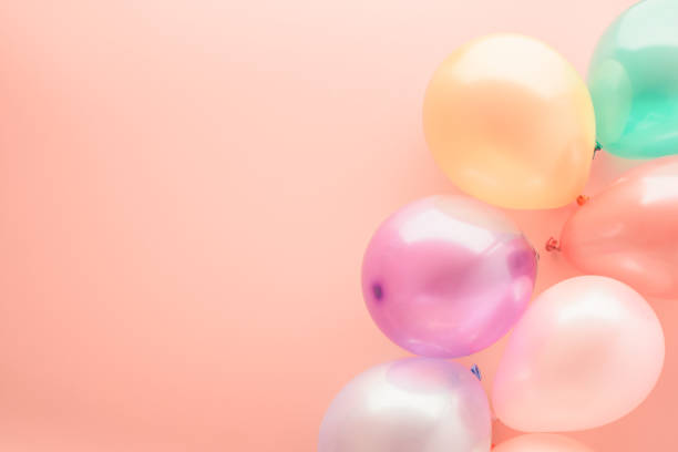 istock Party balloons on pink flat lay 1132831236