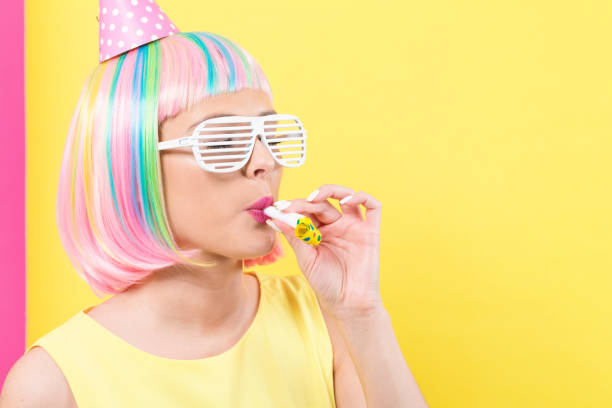 istock Woman in a wig with party accessories 1132831335