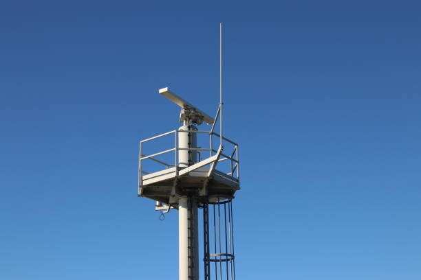 traffic radar antenna at the harbor of ijmuiden to guide the ships in the netherlands at the north sea - sea safety antenna radar imagens e fotografias de stock