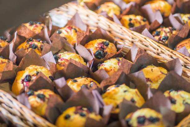 istock chocolate and berry cupcakes in a basket on the bakery window 1132832362
