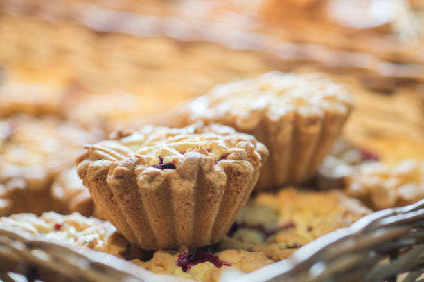 istock berry cupcakes in a basket on the bakery window 1132832370