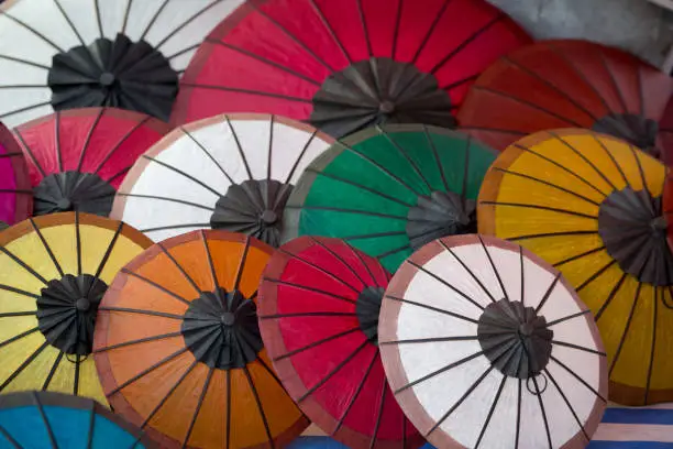 asian umbrellas at the nightmarket in the town of Luang Prabang in the north of Laos in Southeastasia.