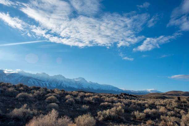 istock blue sky white clouds over desert hills Eastern Sierra Nevada, California, USA 1132838543
