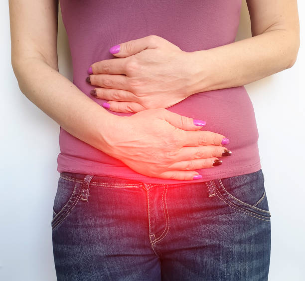 istock woman hurts her stomach 1132838560