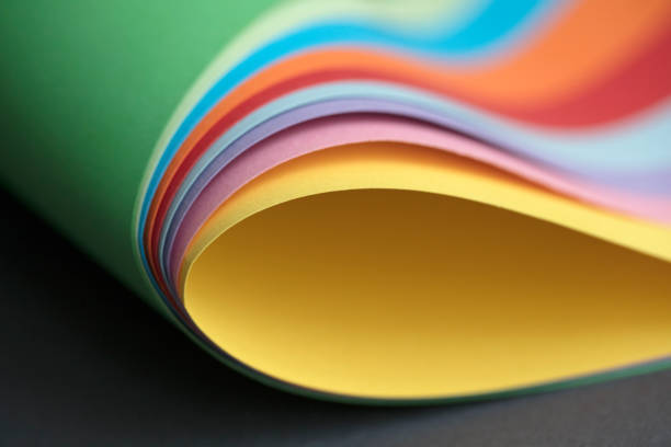 istock Abstract colored papers on blue, pink and orange background. 1132840354