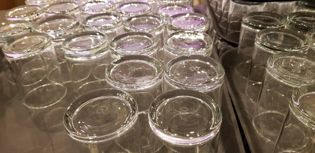 istock rows of empty glasses standing on trays upside down 1132841601