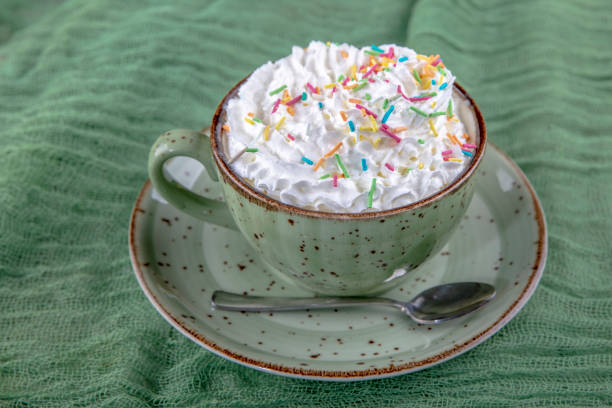 beverage with whipped cream and fresia flowers around, shallow DOF