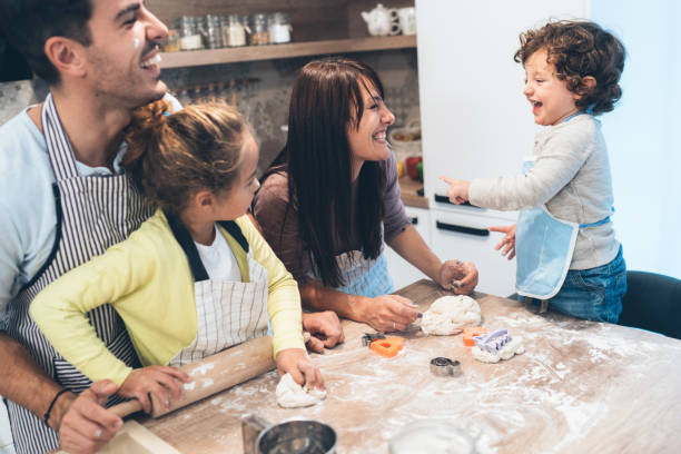 istock Family making cookies in kitchen 1132845155
