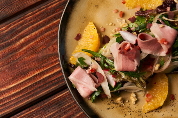 istock Exclusive vegetable salad with Smoked duck breast, close-up 1132846002