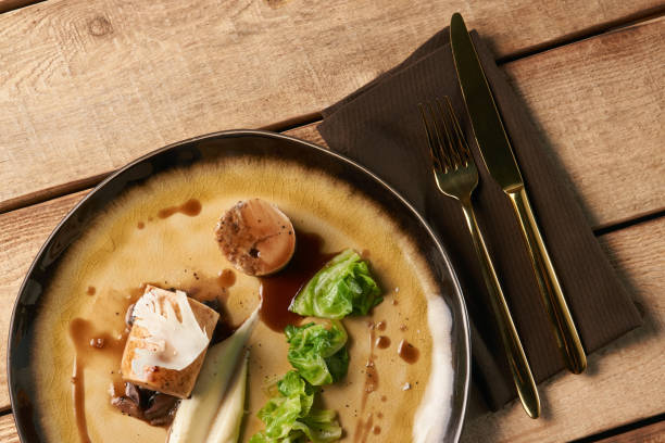 istock Bavarian chicken sausage meat with baked green cabbage 1132846067