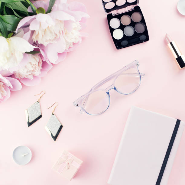 istock Beautiful cosmetics and flowers flat lay with note book, herbal tea on pastel background. 1132846216
