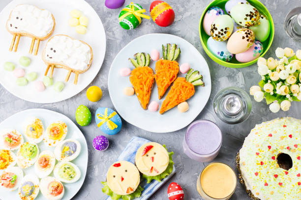 istock Funny colorful Easter food for kids with decorations on table. Easter dinner concept 1132846218