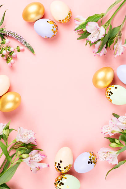 istock Festive Happy Easter background with decorated eggs, flowers, candy and ribbons in pastel colors on pink. Copy space 1132846220