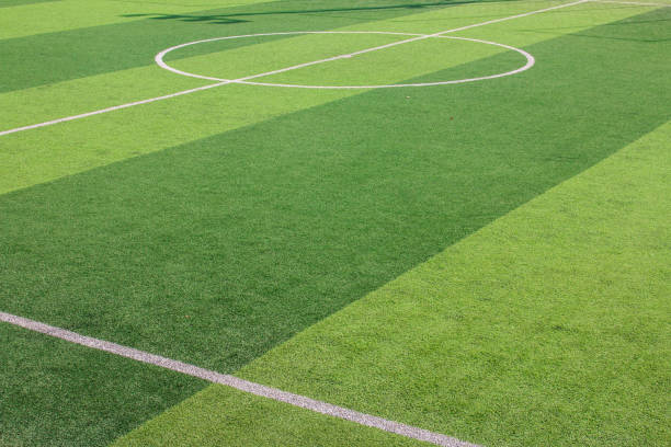 istock The white Line marking on the artificial green grass soccer field 1132847825