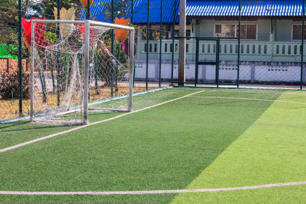 istock The white Line marking on the artificial green grass soccer field 1132847859