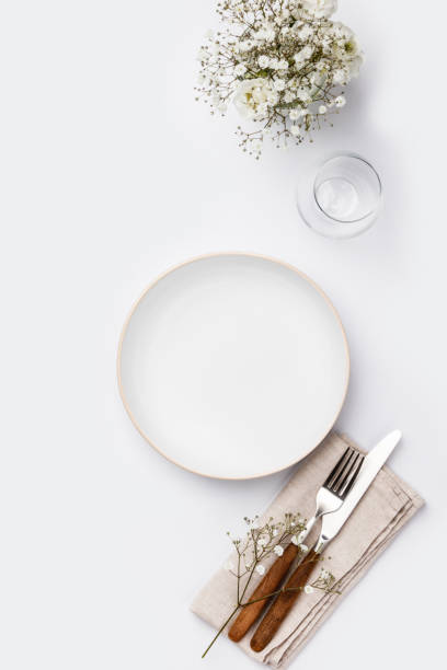 istock Empty white plate and cutlery on a napkin 1132847991