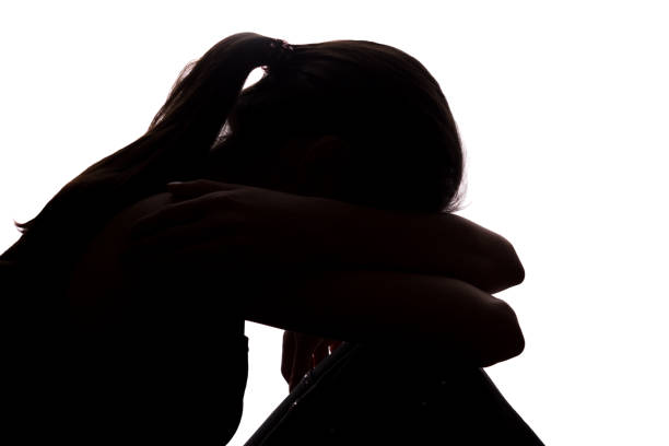istock Silhouette of a young woman with problems 1132848768