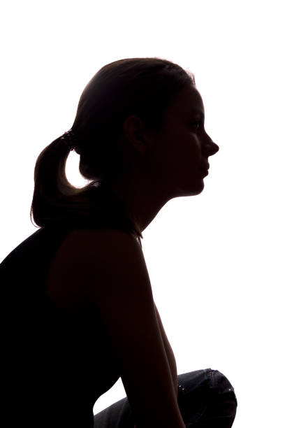 istock Young woman look ahead - vertical silhouette 1132849116