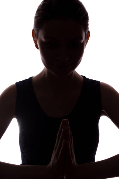istock Young woman looking with hope and request - silhouette 1132849788