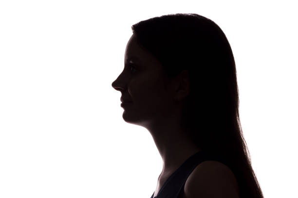 istock Young woman look ahead - horizontal silhouette 1132850435