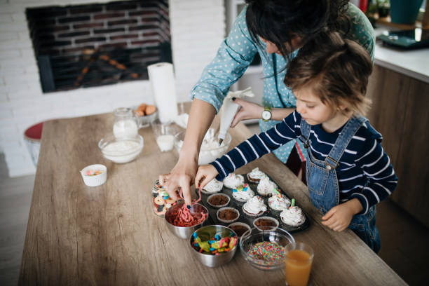 istock Mom and son making muffins 1132850516
