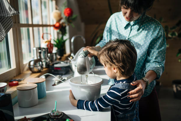 istock Boy assisting his mom in the kitchen 1132851367