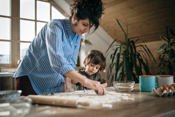 istock Mom and son preparing cookies 1132853503