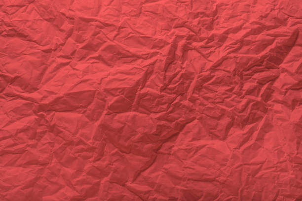 istock Living coral paper wrinkled texture for background and copy-space. 1132853661