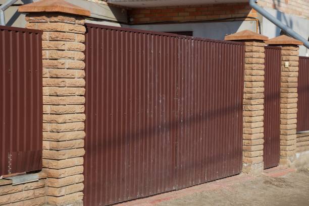 istock one private brown closed metal gate outside 1132855426