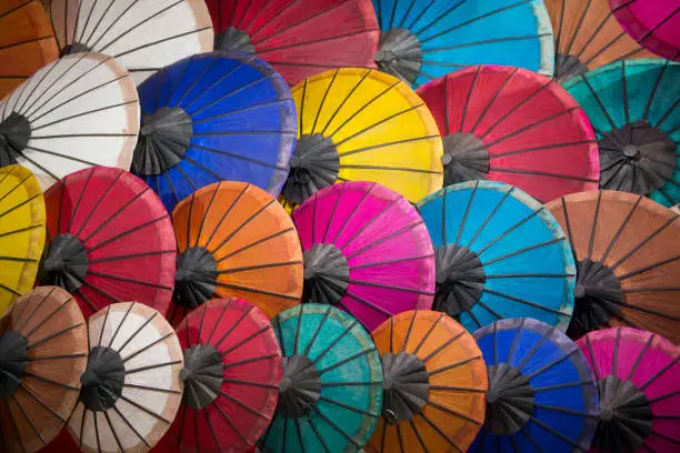 asian umbrellas at the nightmarket in the town of Luang Prabang in the north of Laos in Southeastasia.