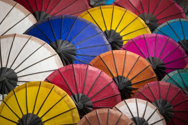 asian umbrellas at the nightmarket in the town of Luang Prabang in the north of Laos in Southeastasia.