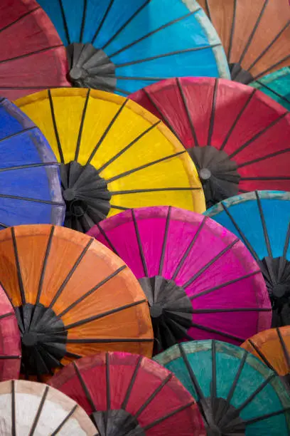 asian umbrellas at the nightmarket in the town of Luang Prabang in the north of Laos in Southeastasia.