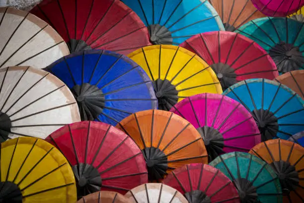 asian umbrellas at the nightmarket in the town of Luang Prabang in the north of Laos in Southeastasia.