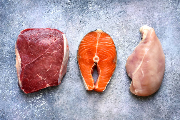 istock Raw marbled meat, red fish and chicken breast 1132856386