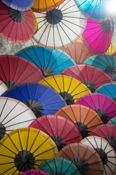 asian umbrellas at the nightmarket in the town of Luang Prabang in the north of Laos in Southeastasia.