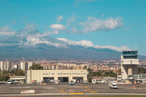 Catania Airport, in Sicily, seen with Mount Etna in the far distance, behind.
