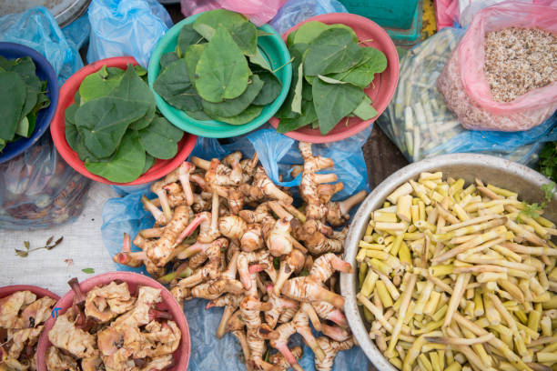 Fegetables at the Taalat Sao market in the city of vientiane in Laos in the southeastasia.