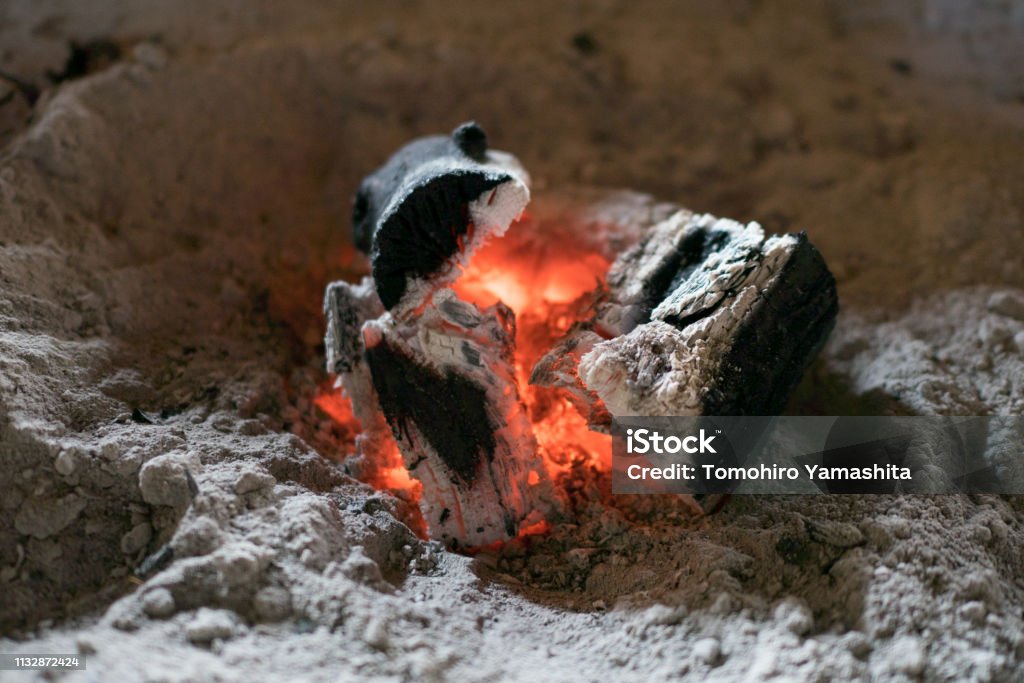 A small charcoal fire A small charcoal fire in a Japanese irori Ash Stock Photo