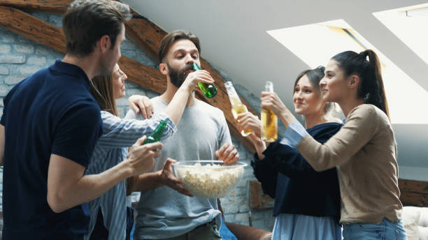istock Girl feeding her friend with popcorn 1132874142