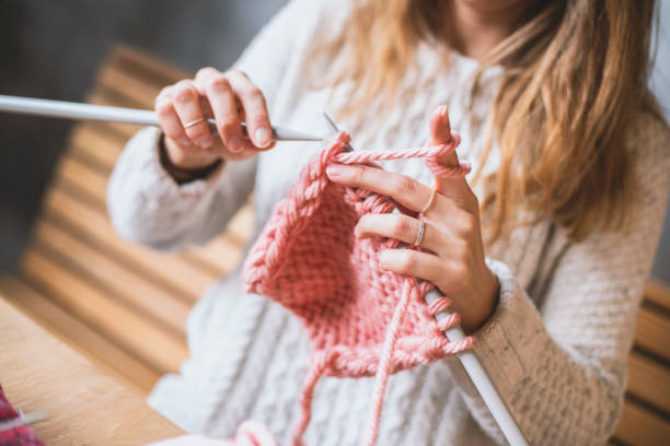 istock Close up on woman's hands knitting 1132874390
